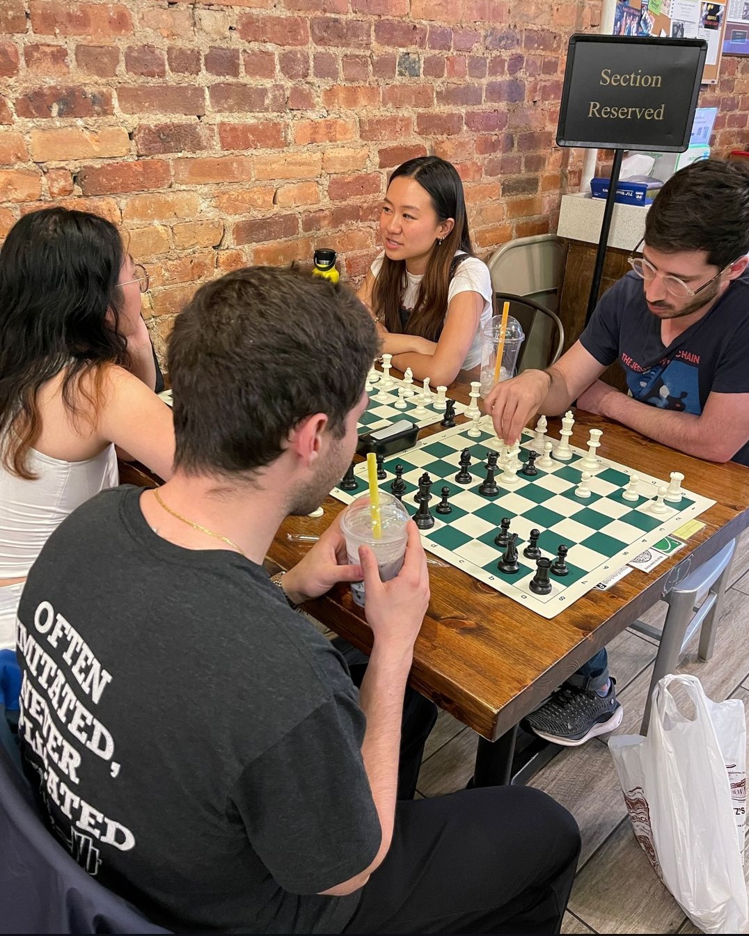 An image of people playing chess